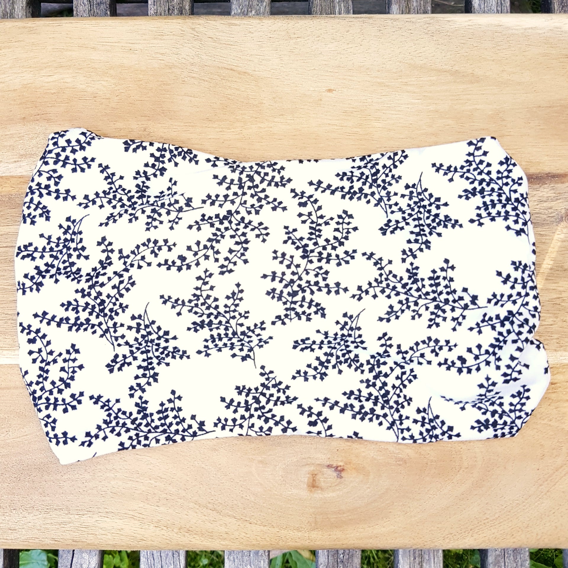 White headband with vine pattern